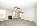 Spacious living room featuring a fireplace and stairs to the second floor at 4007 Bullfinch Way, Westfield, IN 46062