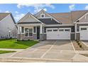 Attractive single-Gathering home boasts a two-car garage, manicured lawn, and stylish stone facade at 3509 Wrangler Dr, Bargersville, IN 46106