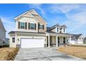 Charming two-story home with stone accents, large windows, and a two-car garage at 68 Sterling Pl, New Whiteland, IN 46184