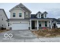 Two story home with a large two car garage and covered front porch at 68 Sterling Pl, New Whiteland, IN 46184