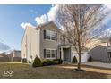 Charming two-story home with gray siding, dark shutters, and a well-maintained lawn and landscape at 13834 Keams Dr, Fishers, IN 46038