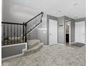 Finished basement with stairs, carpeting, and a half-bathroom at 9426 Park Meridian Dr, Indianapolis, IN 46260