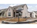 Charming two-story home with brick accents, light brown siding and a Midland Main St street sign at 17368 Pinellas Ave, Westfield, IN 46074