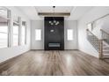 Bright and spacious living room with hardwood floors, fireplace, and a staircase at 17368 Pinellas Ave, Westfield, IN 46074