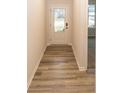 Inviting entryway with wood-look flooring and a view into the adjacent living space at 3922 Holly Brook Dr, Westfield, IN 46062