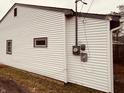Side view of a white vinyl sided home with small window at 2342 Hoyt Ave, Indianapolis, IN 46203
