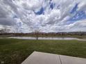 Expansive backyard view overlooking a serene pond, providing a peaceful and picturesque setting at 4208 E Epler Ave, Indianapolis, IN 46237