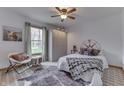 Cozy bedroom featuring a decorative headboard, ceiling fan, and stylish decor at 4208 E Epler Ave, Indianapolis, IN 46237