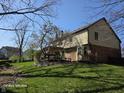 Large backyard with mature trees and green grass, providing ample space for outdoor activities and relaxation at 8429 Admirals Cv, Indianapolis, IN 46236