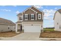 Charming two-story home featuring a two-car garage and stylish neutral color palette at 1837 James Pierce Dr, Shelbyville, IN 46176