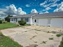 Single story home featuring an attached garage, front yard, and cracked driveway at 4726 E 210 N, Lebanon, IN 46052