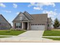 Beautiful single-story brick home with a two-car garage, inviting entrance, and well-kept lawn at 5006 Carmine St, Brownsburg, IN 46112