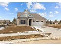 Inviting single-story home with a well-kept lawn, neutral brick facade, and attached garage, perfect for suburban living at 5006 Carmine St, Brownsburg, IN 46112