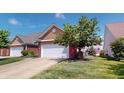 Charming single-Gathering home with well-manicured lawn and a two car garage at 3538 Heathcliff Ct, Westfield, IN 46074