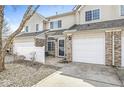 Townhouse with attached garage, fenced yard, vinyl siding, and well-kept landscape at 5845 Shipwatch Pl, Indianapolis, IN 46237