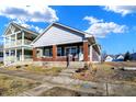 Attractive home with a symmetrical facade, inviting steps, and a neatly kept front yard at 1622 Prospect St, Indianapolis, IN 46203