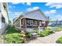 Well-maintained home featuring a landscaped front yard and a classic architectural design at 1622 Prospect St, Indianapolis, IN 46203