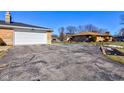 Attached garage with a large driveway at 4522 Thornleigh Dr, Indianapolis, IN 46226