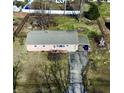 An aerial view showing the home, driveway, and spacious, fenced backyard of the property at 11962 Trolley Rd, Indianapolis, IN 46236