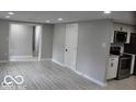 Modern kitchen with white cabinets, stainless steel appliances and gray walls at 231 S Routiers Ave, Indianapolis, IN 46219