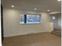 Spacious living room with hardwood floors and large window at 454 Tulip Dr, Mooresville, IN 46158