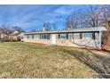 Ranch style home with brick exterior, landscaped lawn, and a spacious front yard at 8390 E Us 36 Hwy, Avon, IN 46123