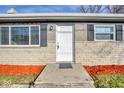 White front door with gray shutters and a brick facade at 8390 E Us 36 Hwy, Avon, IN 46123