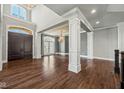 Spacious entryway with hardwood floors and a grand staircase at 1023 Westview Point Dr, Columbus, IN 47201