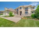 An eye-level view of this home's stylish architectural design, manicured lawn, and stone details at 1023 Westview Point Dr, Columbus, IN 47201