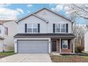 Two-story house with gray siding, brick accents, and a two-car garage at 1127 Maple Stream Dr, Indianapolis, IN 46217