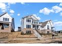 Two-story home with gray siding, brick accents, and a front porch at 1500 Chatham Village Blvd, Westfield, IN 46074