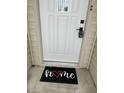 White front door with smart lock and welcome mat at 2914 Rothe Ln, Indianapolis, IN 46229