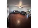 Bright living room with hardwood floors, offering access to the kitchen at 403 Collier St, Columbus, IN 47201