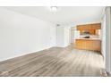 Bright living room with hardwood floors and open concept kitchen at 7820 Bryden Dr, Fishers, IN 46038