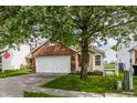 Brick ranch home with attached garage and landscaping at 11552 Glenn Abbey Ln, Indianapolis, IN 46235