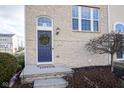 Inviting front entrance with a dark blue door and wreath at 14024 Wimbleton Way, Fishers, IN 46037