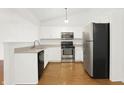 Bright kitchen with stainless steel appliances and ample cabinet space at 14944 Mia Dr, Carmel, IN 46033