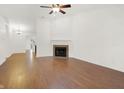 Spacious living room with hardwood floors and a cozy fireplace at 14944 Mia Dr, Carmel, IN 46033