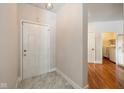 Bright entryway with white door and marble-look flooring at 3740 Magenta Ln # 5, Indianapolis, IN 46214