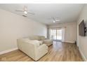 Spacious living room with L-shaped sofa and sliding glass doors at 3740 Magenta Ln # 5, Indianapolis, IN 46214