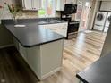 Bright kitchen features updated cabinets, countertops and stainless steel appliances at 409 Lansdowne Rd, Indianapolis, IN 46234