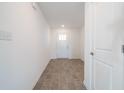 Bright entryway with tile flooring and neutral-colored walls at 4612 Amber Wood Dr, Indianapolis, IN 46235