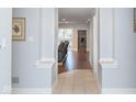 Bright entryway with light tile floors and a view into the living room at 8681 Jaffa Court East Dr # 16, Indianapolis, IN 46260