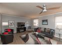 Living room with hardwood floors, fireplace, and comfortable seating at 11 Eastern Ave, Brownsburg, IN 46112