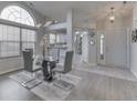 Open concept dining room with kitchen views and modern light fixture at 2814 Cadogan Dr, Greenwood, IN 46143