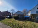 Small gray house with a front porch,needs landscaping at 2826 Station St, Indianapolis, IN 46218