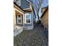 Side yard with a tree and gravel pathway, offering privacy and charm at 2955 N Olney St, Indianapolis, IN 46218