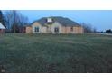 Stone and brick house with a grassy yard at 7099 S 1100 W, Jamestown, IN 46147