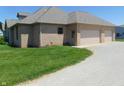 Spacious three car garage offers ample parking and storage space at 7099 S 1100 W, Jamestown, IN 46147