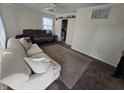 Spacious living room with neutral carpeting and ample natural light at 7328 Parkside Dr, Lawrence, IN 46226